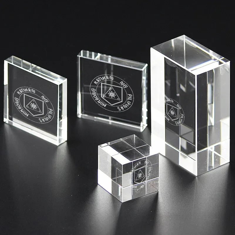 Four clear crystal blocks of different shapes, each etched with the Philippine Army seal